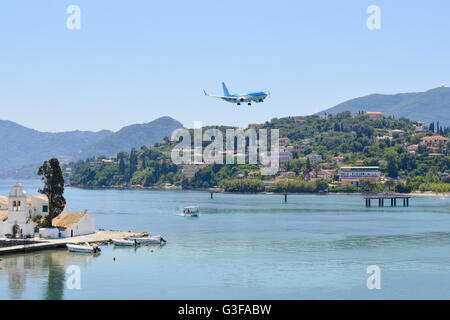 Airplane flying above a bay in the coastal area