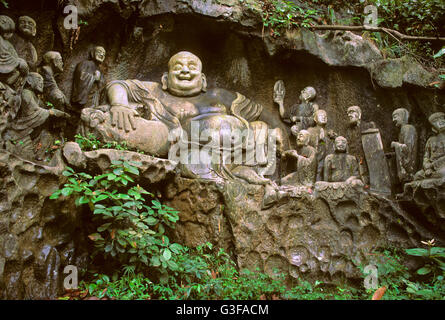 Buddha carved in the rock at the Peak Flying from Afar, near to the Temple of Soul's Retreat, Hangzhou, Zhejiang Province, China Stock Photo