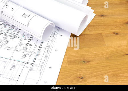 architectural background with floor plans and rolled technical drawings Stock Photo