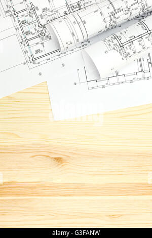 sketch with roll of blueprints on wooden background Stock Photo - Alamy
