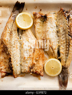 Oven baked sea bass fish Stock Photo - Alamy