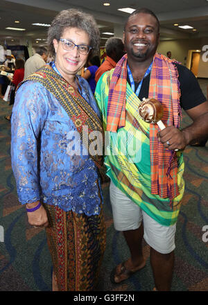 Miami, Florida, USA. 9th June, 2016. Delegates from Suriname pose in traditional fashions at the Caribbean Festival during the 5-day Taste of the Caribbean Culinary Showcase presented by the Caribbean Hotel and Tourism Association at Hyatt Regency Miami on June 9, 2016 in Miami, USA. Credit:  SEAN DRAKES/Alamy Live News Stock Photo