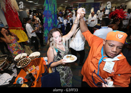 Miami, Florida, USA. 9th June, 2016. Guests and chefs dance to soca music at the Caribbean Festival during the 5-day Taste of the Caribbean Culinary Showcase presented by the Caribbean Hotel & Tourism Association at Hyatt Regency Miami on June 9, 2016 in Miami, USA. Credit:  SEAN DRAKES/Alamy Live News Stock Photo