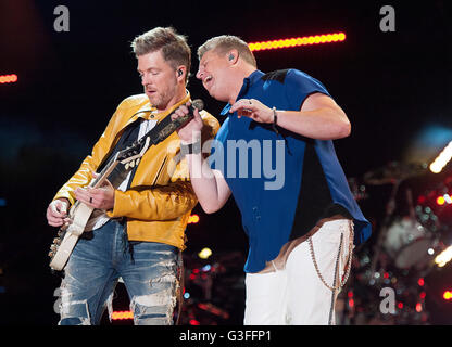 Jun. 09, 2016 - Nashville, Tennessee; USA - (L-R) Guitarist JOE DON ROONEY and Singer GARY LEVOX of the band RASCAL FLATTS performs at Nissan Stadium as part of the 2016 CMA Music Festival that is taking place in downtown Nashville. The four day country music festival will attract thousands of fans from around the world to see a variety of artist on multiple stages. Copyright 2016 Jason Moore. © Jason Moore/ZUMA Wire/Alamy Live News Stock Photo