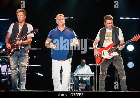 Jun. 09, 2016 - Nashville, Tennessee; USA - (L-R) Guitarist JOE DON ROONEY, Singer GARY LEVOX and Bass Guitarist JAY DEMARCUS of the band RASCAL FLATTS performs at Nissan Stadium as part of the 2016 CMA Music Festival that is taking place in downtown Nashville. The four day country music festival will attract thousands of fans from around the world to see a variety of artist on multiple stages. Copyright 2016 Jason Moore. © Jason Moore/ZUMA Wire/Alamy Live News Stock Photo