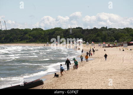 Gdansk, Poland 11th, June 2016 Sunny but cold Saturday in Gdansk, After few weeks of very warm weather, today temperature dropped to 14 Celsius degrees. Cooling sensation is intensified by a strong northern wind. People walking along the Baltic Sea coast are seen. Credit:  Michal Fludra/Alamy Live News Stock Photo