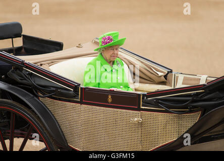 London, UK. 11th June 2016. HM Queen Elizabeth II takes the salute and inspects the parade at this year’s Queen's Birthday Parade which is held on the second Saturday in June to mark Her Majesty's Official Birthday.    The Queen’s Birthday Parade, more popularly known as Trooping the Colour, is when the Queen’s Colour is “Trooped” in front of Her Majesty The Queen and all the Royal Colonels. This year the honour falls to No 7 Company of The Coldstream Guards. Credit:  LondonView/Alamy Live News Stock Photo