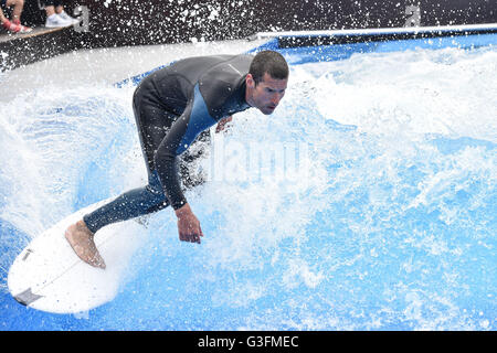 Vienna, Austria. 11th June, 2016. A man surfs in a wave pool built in Vienna, Austria, June 11, 2016. The wave pool in Vienna opens from 10 A.M. to 10 P.M. until this September. Credit:  Qian Yi/Xinhua/Alamy Live News Stock Photo