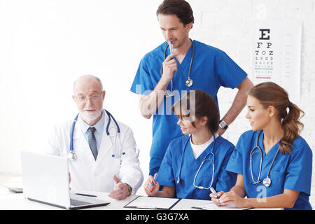 Medical doctors team using computer isolated on white Stock Photo