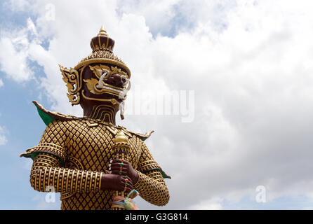 Giant Statue in Temple on sky background, Thailand. Art vintage style in Places of worship. Stock Photo