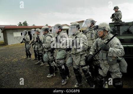 Oregon Air National Guard Security Force members train during riot control operations against simulated protestors at the Camp Rilea training village June 10, 2016 in Warrenton, Oregon. The training is part of exercise Cascadia Rising role playing scenario following a 9.0 magnitude earthquake. Stock Photo