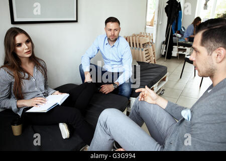 Creative business team working hard together in office Stock Photo