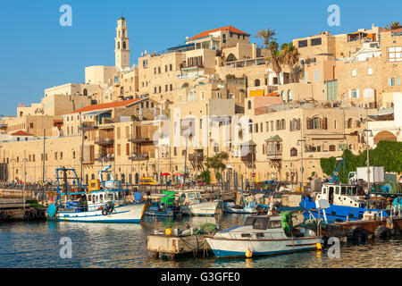 Boats on small harbor and old houses in Jaffa, Israel.