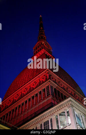 On 4 may, the 67 anniversary of the Superga air disaster, where players of the 'Grande Torino' lost their lives in a plane crash, the symbol of Turin, the Mole Antonelliana is lighted with red-Garnet and the main façade is projected the team's symbol (Photo by: Daniela Parra Saiani/Pacific Press) Stock Photo