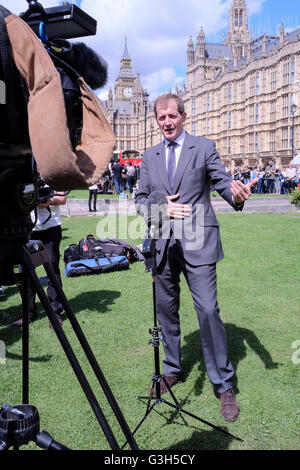 Alastair Campbell, former government Director of Communications and Strategy is interviewed live on camera opposite Houses of Parliament, Stock Photo