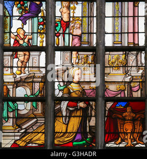 LIER, BELGIUM - MAY 16, 2015: Stained Glass window created in 1545 in St Gummarus Church in Lier, Belgium Stock Photo
