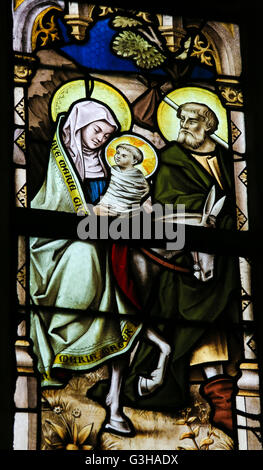 LIER, BELGIUM - MAY 16, 2015: Stained Glass window in St Gummarus Church in Lier, Belgium, depicting Joseph, Mary and Jesus Stock Photo