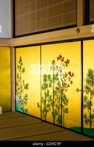 Japan, Nagoya castle. Reconstructed Hommaru Palace interior. Room, part of the Omote Shoin, main hall, with wall panel paintings of flowers and trees. Stock Photo