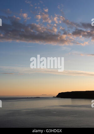 Sunset view towards a distant Barra from Sanday, Canna, Scotland