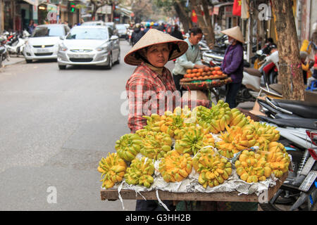 Hanoi, Vietnam: February 20, 2016: Woman selling Buddha's hand Lemons in a street of Hanoi Stock Photo