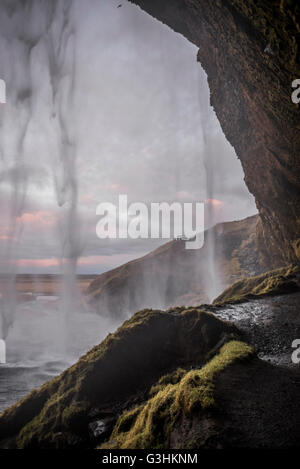 View from behind waterfall, Seljalandsfoss, Iceland Stock Photo