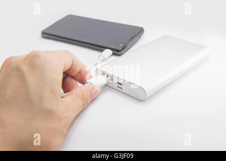 connect the power bank to mobile phone Stock Photo