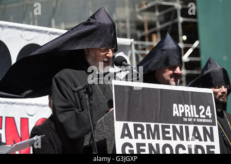 Archbishop Oshagan Choloyan, Prelate of the Eastern Diocese of thE Armenian Church in America, offers an opening benediction. Thousands of Armenian-Americas from throughout the New York City metro area, clergy, scholars and elected public officials gathered in Times Square to commemorate the 101st anniversary of the 1915 Armenian Genocide, and to raise awareness of the current struggle by ethnic Armenians in the Nagorno-Karabakh region of Azerbaijn at the center of a military campaign between the two nations. (Photo by Albin Lohr-Jones/Pacific Press) Stock Photo