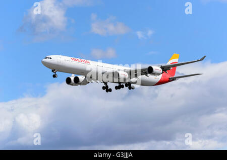 Airliner -Airbus A340-, of spanish airline -Iberia-, is coming, ready to land, to Madrid Barajas airport (Spain) Stock Photo