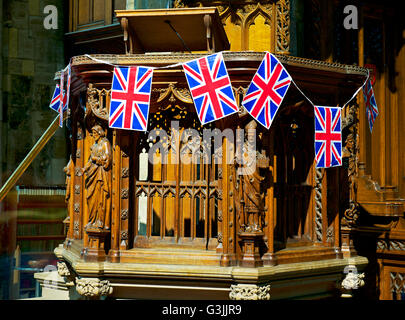 The pulpit, decorated with flags, of Selby Abbey, North Yorkshire, England UK Stock Photo