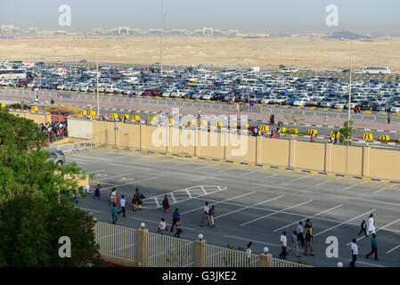 QATAR, Doha, parking place at religious complex with christian churches for migrant workers and shopping Mall Ansar in the back Stock Photo