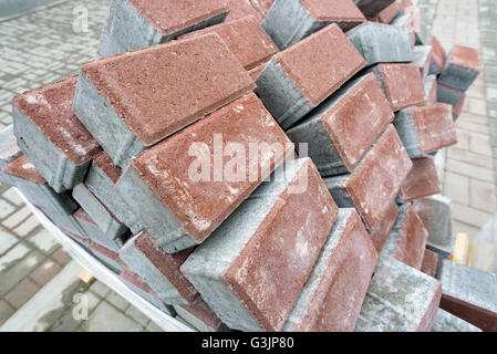 Pile of new clean construction bricks in a haphazard disordered arrangement. Image use for construction building based ideas Stock Photo