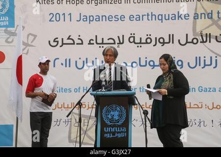 Gaza, Palestine. 13th Mar, 2016. Deputy Representative of the Embassy of Japan in the Palestinian territories 'Mr. Makoto Hirose' mark the fifth anniversary of the tsunami in Japan during solidarity with the Japanese people near a Japanese-funded housing project in Khan Younis in the southern Gaza Strip. The event was organized by the United Nations Relief and Works Agency (UNRWA) to mark the fifth anniversary of the March 11 earthquake and tsunami that killed thousands and set off a nuclear crisis in Japan. © Mohammed Al Hajjar/RoverImages/Pacific Press/Alamy Live News Stock Photo