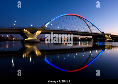 Lowry Avenue bridge in Minneapolis, Minnesota at dusk with blue and red lighting. Stock Photo