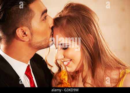 2 Foreigner Married Couples hotel Dating Forehead Kissing Stock Photo