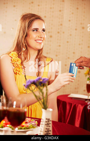 2 People Adult Foreigner Woman and Waiter hotel Dinner Giving Bills Stock Photo