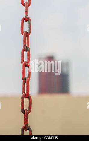 Old chain on a construction site. Stock Photo