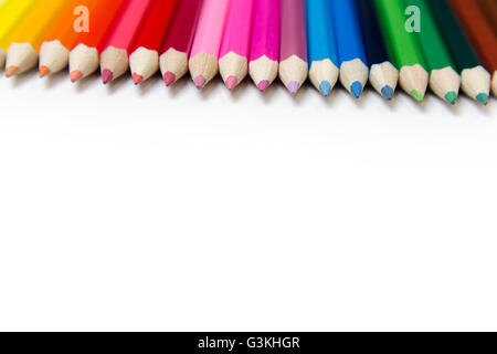 Colored pencils on white table Stock Photo