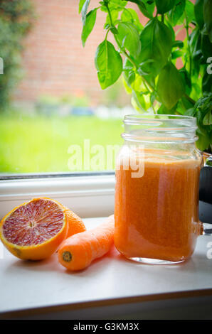 orange and carrot juice, healthy juicing Stock Photo