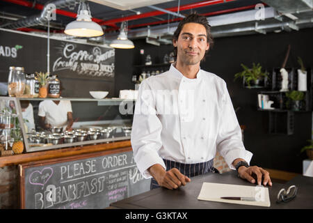 Chef in restaurant looking at camera Stock Photo
