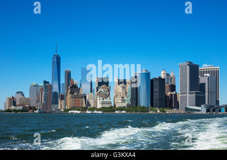 Skyline of Lower Manhattan as seen from the Staten Island Ferry crossing New York Harbor Stock Photo