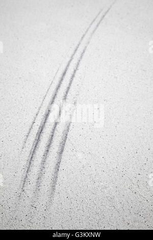 Tire tracks, skid marks on a parking lot Stock Photo