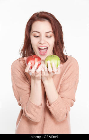 Young woman holding two apples Stock Photo