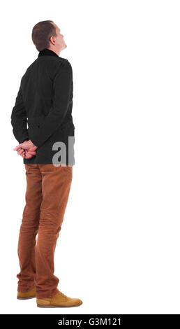 Back view of stylishly dressed man in a brown jackett looking up. Standing young guy in jeans and jacket. Rear view people collection. backside view of person. Isolated over white background. Stock Photo