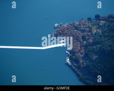 Iseo Lake, Italy. 12th June, 2016. Aerial view of Christo's 'The Floating piers' project are now completed but not yet accessed by people. The piers are made up of floating polyethylene cubes and covered with fabric creating the walkways. Riccardo Mottola/Alamy Live News Stock Photo