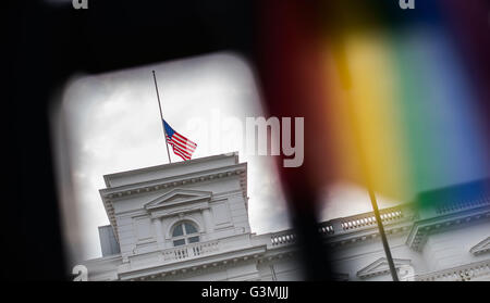 Hamburg, Germany. 13th June, 2016. The US national flag flies at half-mast in memory of the victims of a mass shooting in Orlando, USA on 12 June, at the US Consulate in Hamburg, Germany, 13 June 2016. A total of 50 people inculding the suspect were killed and 53 were injured in a shooting attack at an LGBT club in Orlando, Florida, in the early hours of 12 June. The shooter, Omar Mateen, 29, a US citizen of Afghan descent, was killed in an exchange of fire with the police after taking hostages at the club. Photo: Lukas Schulze/dpa/Alamy Live News Stock Photo