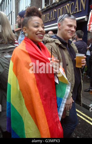 London, UK. 13th June, 2016. Crowds gather  outside the Admiral Duncan pub to release 50 balloons in memory of those shot at the Pulse club in Orlando. Credit:  JOHNNY ARMSTEAD/Alamy Live News Stock Photo