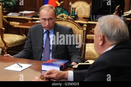 Moscow, Russia. 14th June, 2016. Russian President Vladimir Putin listens to President of the Russian Academy of Sciences Vladimir Fortov during a meeting at the Kremlin June 14, 2016 in Moscow, Russia. Credit:  Planetpix/Alamy Live News