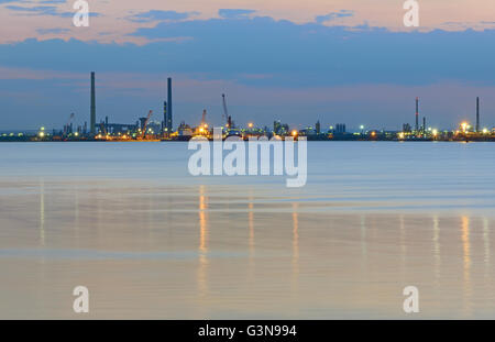 Industrial plant and sea in night time Stock Photo