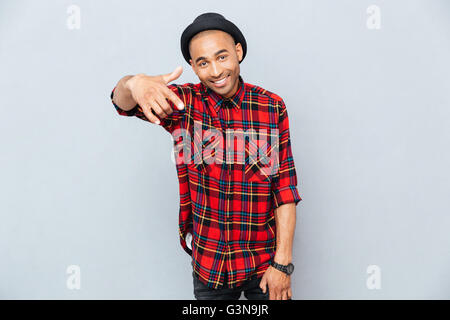 Cheerful attractive african man pointing on you Stock Photo