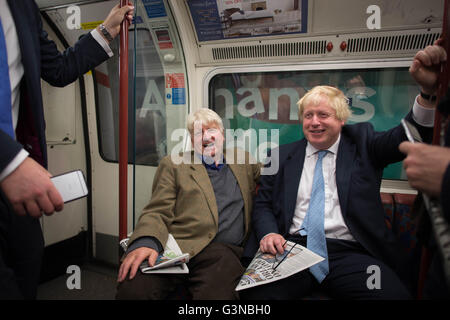 Boris Johnson sits next to his father Stanley (left) on the Bakerloo Line as he bumped into him by chance on the tube train as it left Marylebone Station in London. Stock Photo